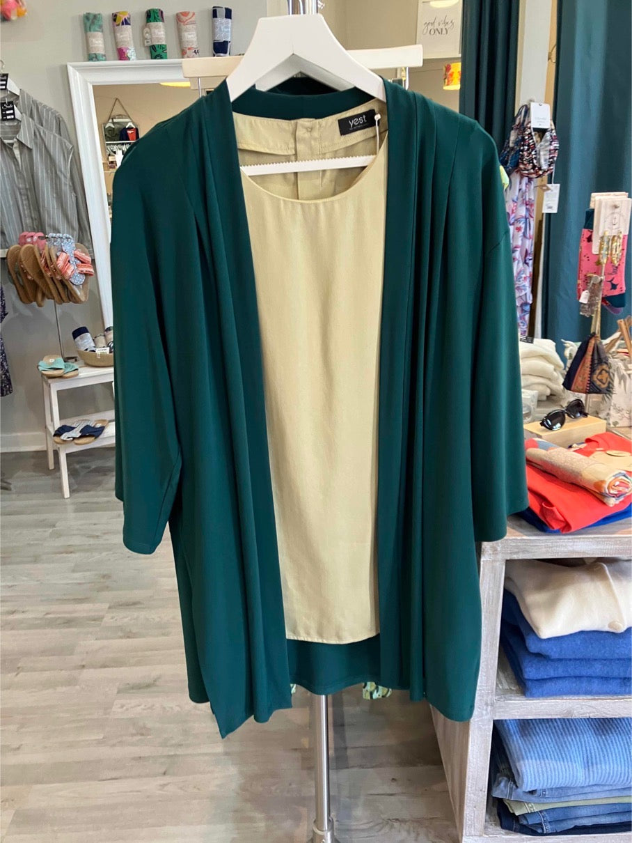 Paz Torras green jacket waterfall neckline