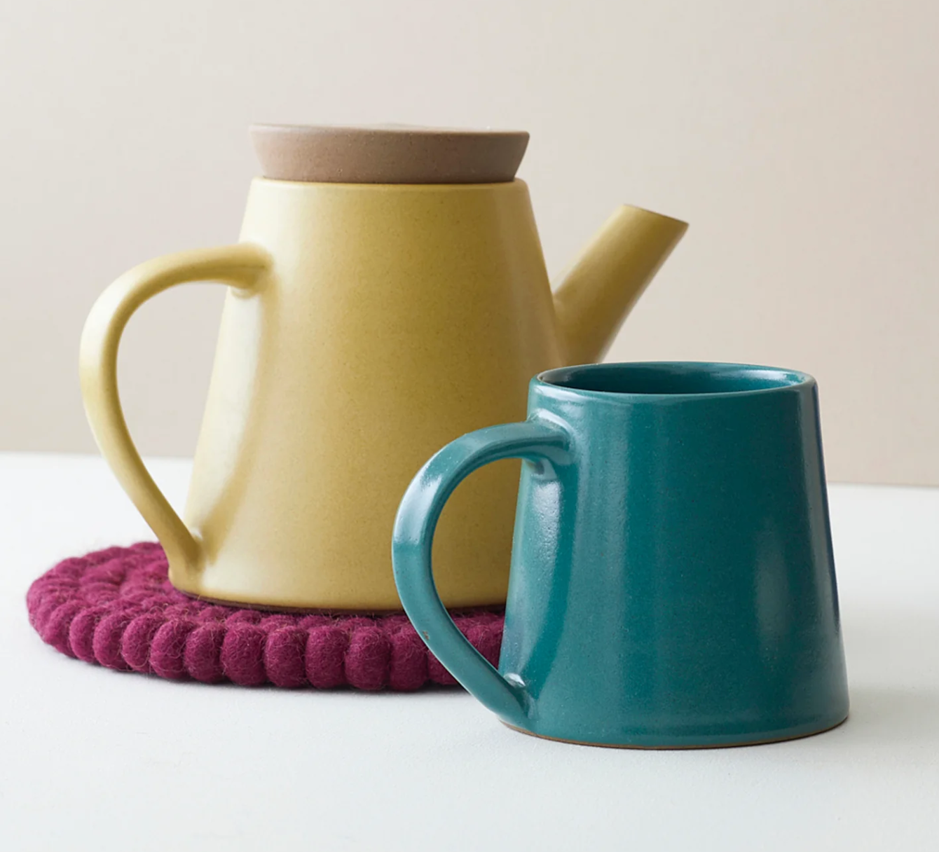 Aura Que Alo mug in teal