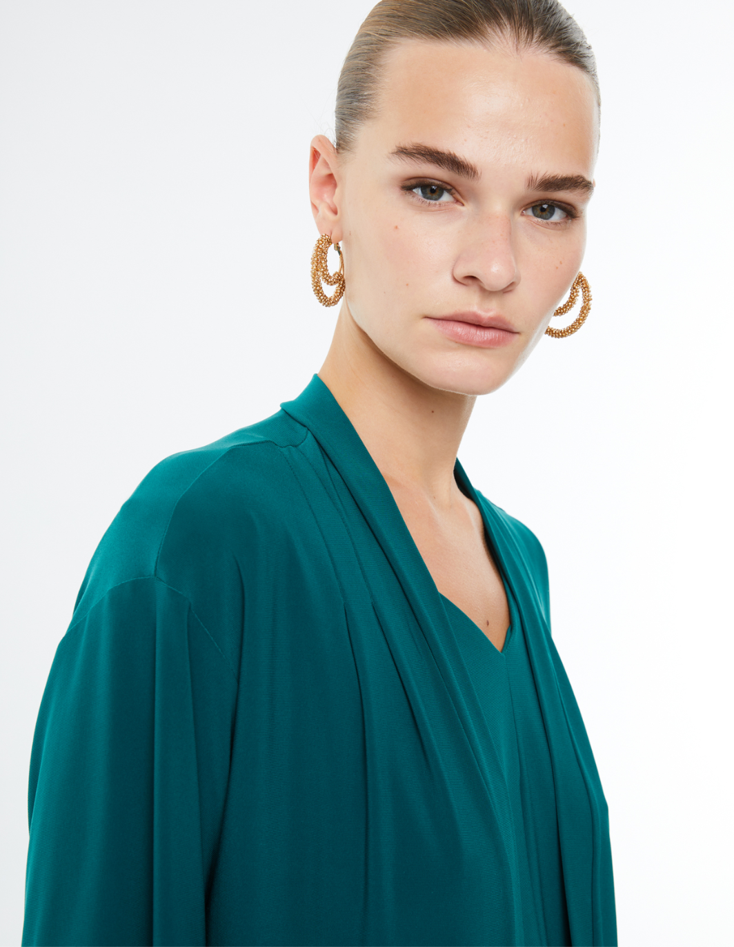 Paz Torras green jacket waterfall neckline