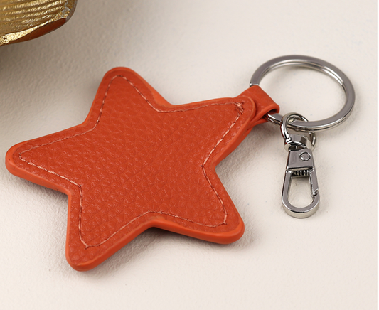 Pom faux leather star keyring - various colours