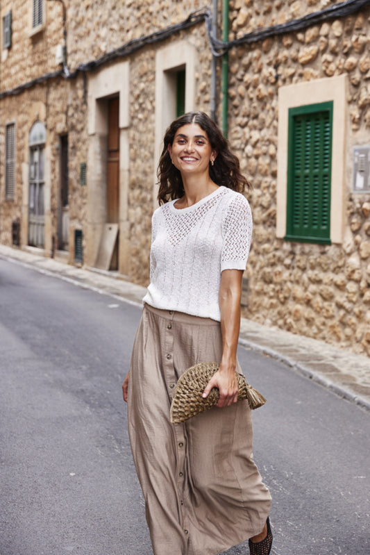 Long beige skirt with button front detail