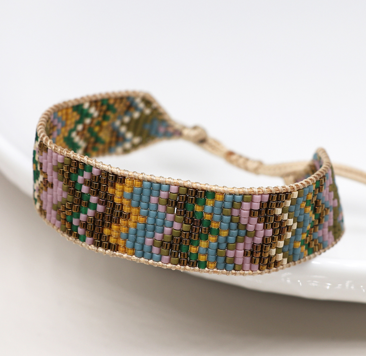Pom adjustable woven earthy mix zig zag bracelet