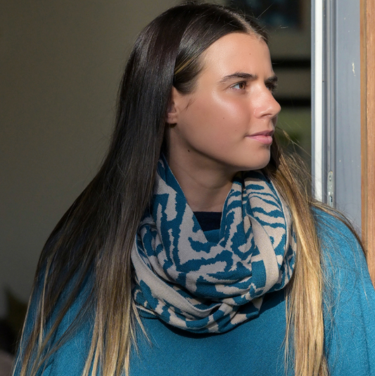 Woman wearing a blue geometric patterned snood 