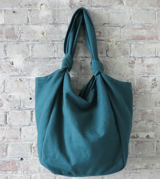 Aura que Jogi bag in teal - leafy green